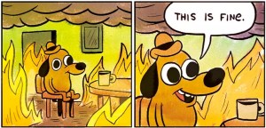 Image from KC Green's comic "Gunshow," featuring a yellow cartoon dog with a small hat sitting at a table with a mug of coffee, saying “This is fine,” while the surrounding house is actually on fire.